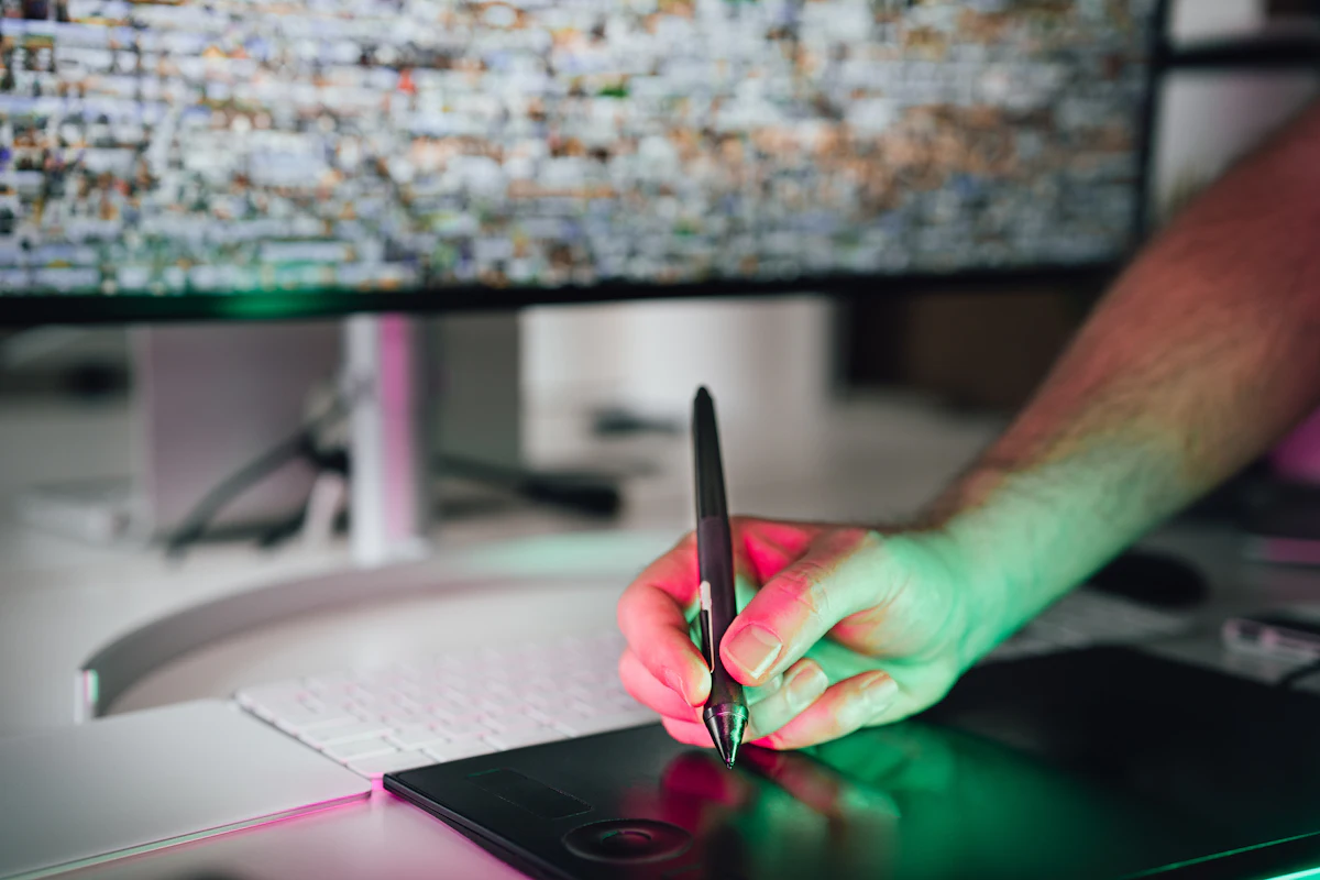 Rhea drawing on a tablet at her desk